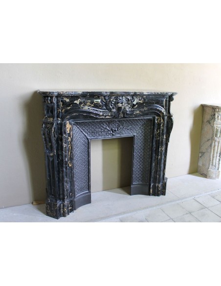 Exceptional Louis XV "Heart" antique fireplace mantel in Black Portoro Gold marble, complete with decorative cast-iron insert.