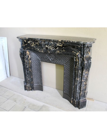 Exceptional Louis XV "Heart" antique fireplace mantel in Black Portoro Gold marble, complete with decorative cast-iron insert.
