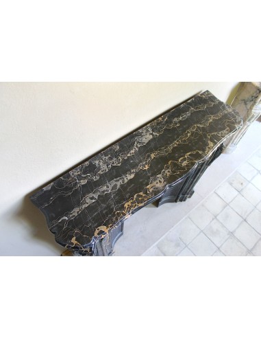 Exceptional Louis XV "Heart" antique fireplace mantel in Black Portoro Gold marble, complete with decorative cast-iron insert.