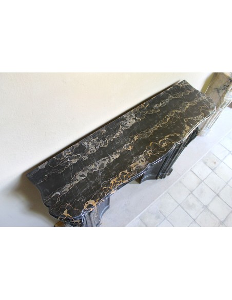 Exceptional Louis XV "Heart" antique fireplace mantel in Black Portoro Gold marble, complete with decorative cast-iron insert.