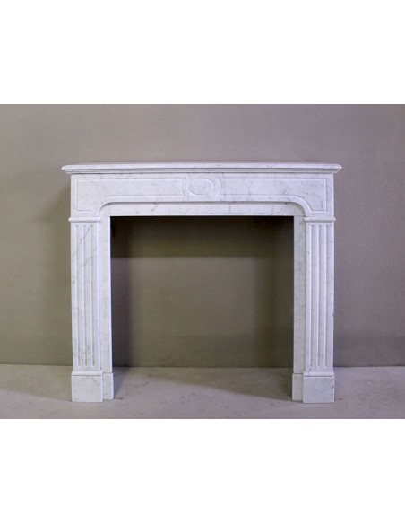 Antique Neoclassical fireplace mantel in White Carrara marble, with clean, elegant lines, available at a discounted price.