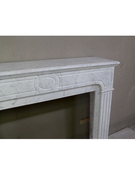 Antique Neoclassical fireplace mantel in White Carrara marble, with clean, elegant lines, available at a discounted price.