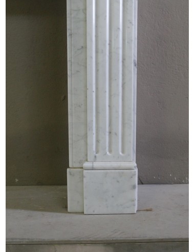 Antique Neoclassical fireplace mantel in White Carrara marble, with clean, elegant lines, available at a discounted price.