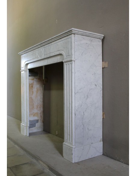 Antique Neoclassical fireplace mantel in White Carrara marble, with clean, elegant lines, available at a discounted price.