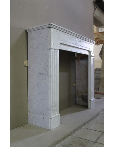 Antique Neoclassical fireplace mantel in White Carrara marble, with clean, elegant lines, available at a discounted price.