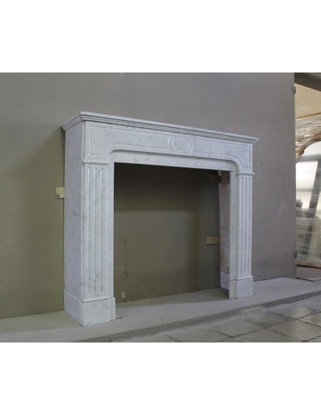 Antique Neoclassical fireplace mantel in White Carrara marble, with clean, elegant lines, available at a discounted price.