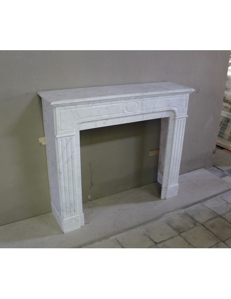Antique Neoclassical fireplace mantel in White Carrara marble, with clean, elegant lines, available at a discounted price.