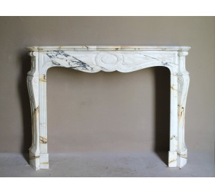 Large antique Baroque "Pied Galbé" fireplace mantel in rare White Pavonazzo Statuary marble with elegant contrasting veining.
