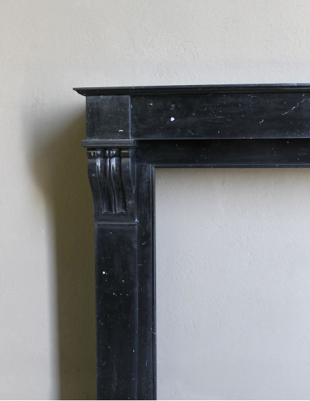 Antique Louis Philippe "Modillon" fireplace mantel in Black Marquina marble, for sale at a low discounted price.
