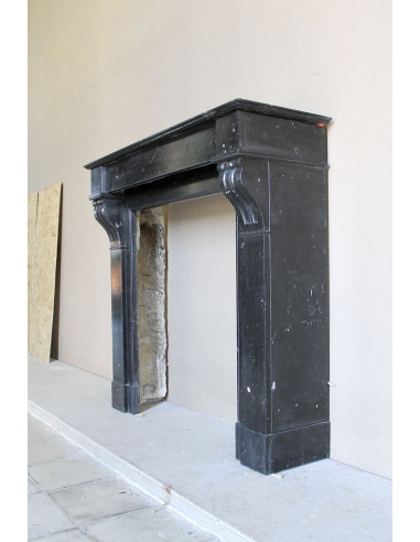 Antique Louis Philippe "Modillon" fireplace mantel in Black Marquina marble, for sale at a low discounted price.