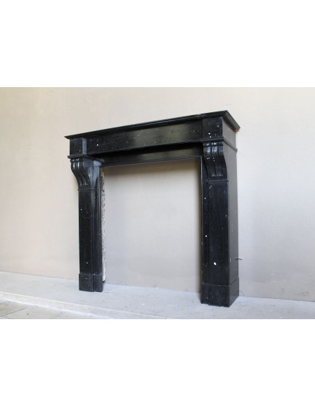 Antique Louis Philippe "Modillon" fireplace mantel in Black Marquina marble, for sale at a low discounted price.
