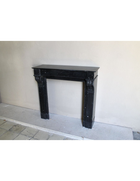 Antique Louis Philippe "Modillon" fireplace mantel in Black Marquina marble, for sale at a low discounted price.