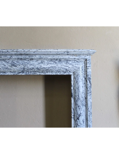 Rare small antique Louis XIV “Boudin Carré” fireplace mantel in elegant grey and blue Bleu Fleuri marble.