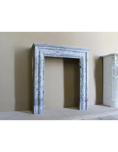 Rare small antique Louis XIV “Boudin Carré” fireplace mantel in elegant grey and blue Bleu Fleuri marble.