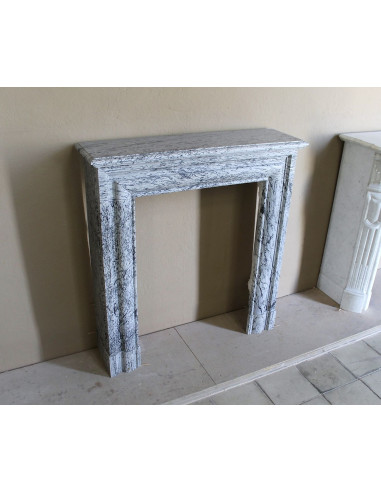 Rare small antique Louis XIV “Boudin Carré” fireplace mantel in elegant grey and blue Bleu Fleuri marble.