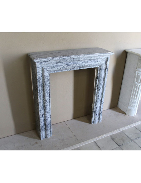 Rare small antique Louis XIV “Boudin Carré” fireplace mantel in elegant grey and blue Bleu Fleuri marble.