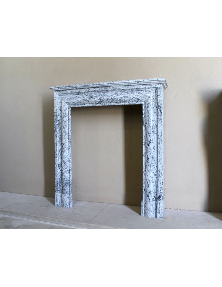 Rare small antique Louis XIV “Boudin Carré” fireplace mantel in elegant grey and blue Bleu Fleuri marble.