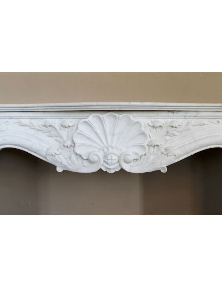 Antique Baroque “Fiorentino” fireplace, finely carved from “Pure” white Carrara marble, with rich floral carvings.