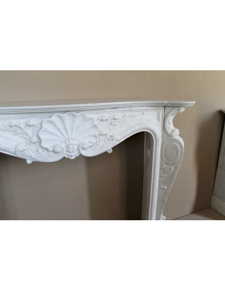 Antique Baroque “Fiorentino” fireplace, finely carved from “Pure” white Carrara marble, with rich floral carvings.