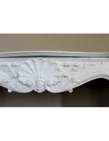 Antique Baroque “Fiorentino” fireplace, finely carved from “Pure” white Carrara marble, with rich floral carvings.