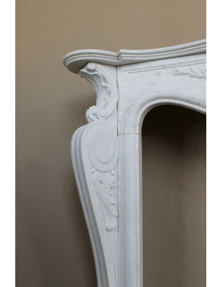 Antique Baroque “Fiorentino” fireplace, finely carved from “Pure” white Carrara marble, with rich floral carvings.