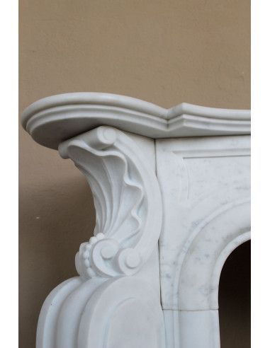 Antique Baroque “Fiorentino” fireplace, finely carved from “Pure” white Carrara marble, with rich floral carvings.