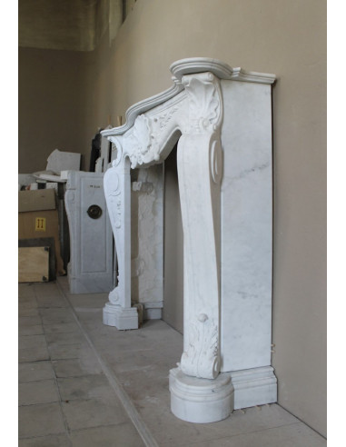 Antique Baroque “Fiorentino” fireplace, finely carved from “Pure” white Carrara marble, with rich floral carvings.