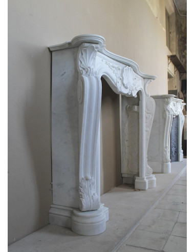 Antique Baroque “Fiorentino” fireplace, finely carved from “Pure” white Carrara marble, with rich floral carvings.