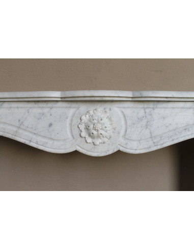 Antique “Pompadour” mantel in white Carrara marble at a discounted price, on sale. A beautiful mantelpiece at a very low price.