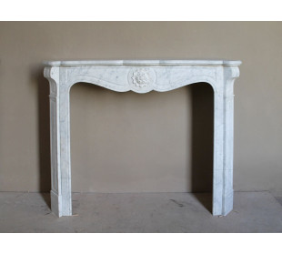 Antique “Pompadour” mantel in white Carrara marble at a discounted price, on sale. A beautiful mantelpiece at a very low price.