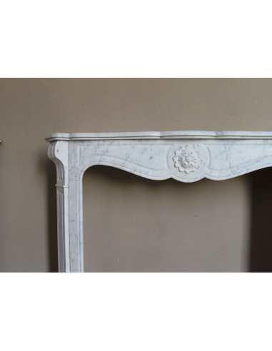 Antique “Pompadour” mantel in white Carrara marble at a discounted price, on sale. A beautiful mantelpiece at a very low price.