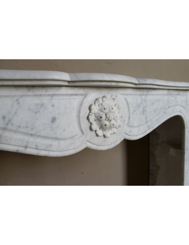 Antique “Pompadour” mantel in white Carrara marble at a discounted price, on sale. A beautiful mantelpiece at a very low price.
