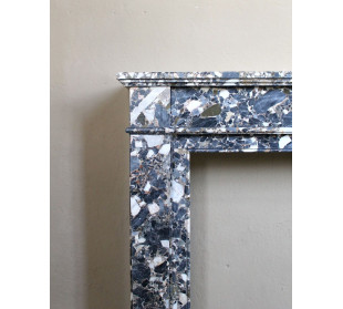 Antique Neoclassical marble fireplace, with minimalist lines and elegant multicolored veining on a dark background. 2
