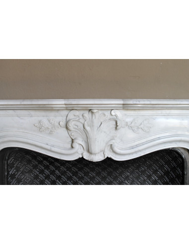 Antique Baroque “Olive Branch” fireplace mantel in white Carrara marble, with its original “Tapisserie” cast-iron insert.