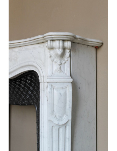 Antique Baroque “Olive Branch” fireplace mantel in white Carrara marble, with its original “Tapisserie” cast-iron insert.