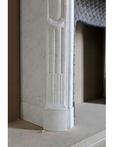 Antique Baroque “Olive Branch” fireplace mantel in white Carrara marble, with its original “Tapisserie” cast-iron insert.