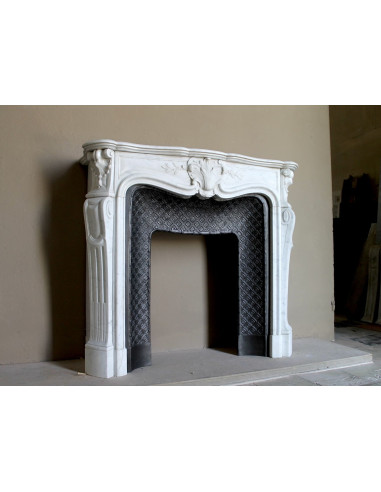 Antique Baroque “Olive Branch” fireplace mantel in white Carrara marble, with its original “Tapisserie” cast-iron insert.