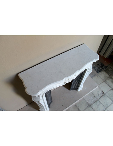 Antique Baroque “Olive Branch” fireplace mantel in white Carrara marble, with its original “Tapisserie” cast-iron insert.