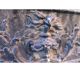 Antique cast iron insert with floral decorations for an antique marble fireplace mantel. 2