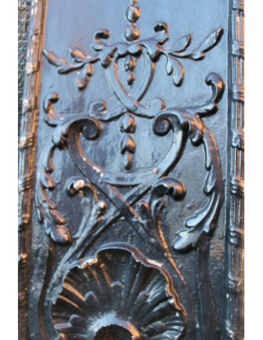 Antique cast iron insert with floral decorations for an antique marble fireplace mantel.