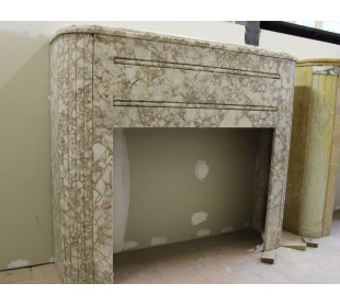 Antique Art Deco style fireplace carved in a beige marble from an uncensored quarry