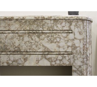 Antique Art Deco style fireplace carved in a beige marble from an uncensored quarry 2