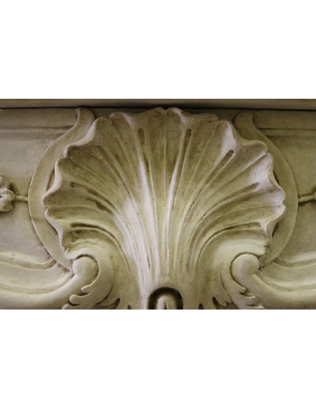 926 VERY RARE, FLORAL AND LOVELY “TRANSITION” FIREPLACE IN PIERRE DORÉE STONE