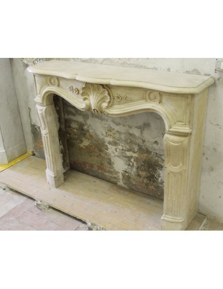 926 VERY RARE, FLORAL AND LOVELY “TRANSITION” FIREPLACE IN PIERRE DORÉE STONE