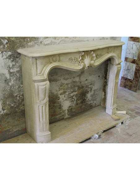 926 VERY RARE, FLORAL AND LOVELY “TRANSITION” FIREPLACE IN PIERRE DORÉE STONE