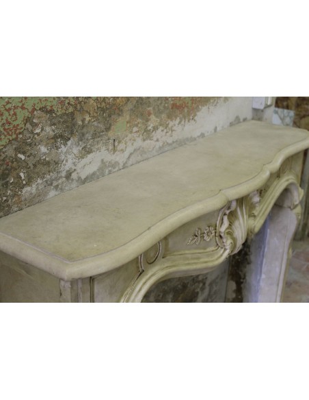 926 VERY RARE, FLORAL AND LOVELY “TRANSITION” FIREPLACE IN PIERRE DORÉE STONE