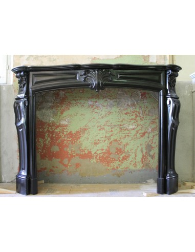 Antique Louis XV "Transition" fireplace mantel carved in Black Belgium marble.