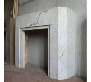 Beautiful antique Art Deco-style fireplace mantel carved in White veined Carrara marble.