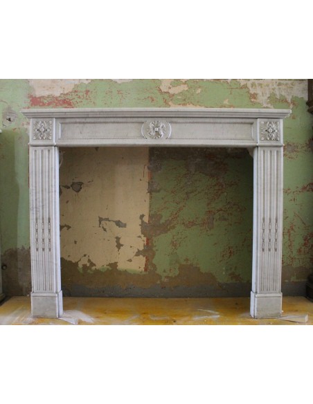 Original and truly antique Neoclassical marble fireplace carved in the 19th century.
