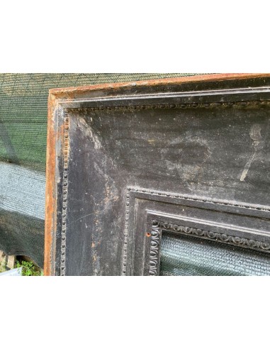 Antique cast iron insert designed to reduce the opening of a marble fireplace mantel.